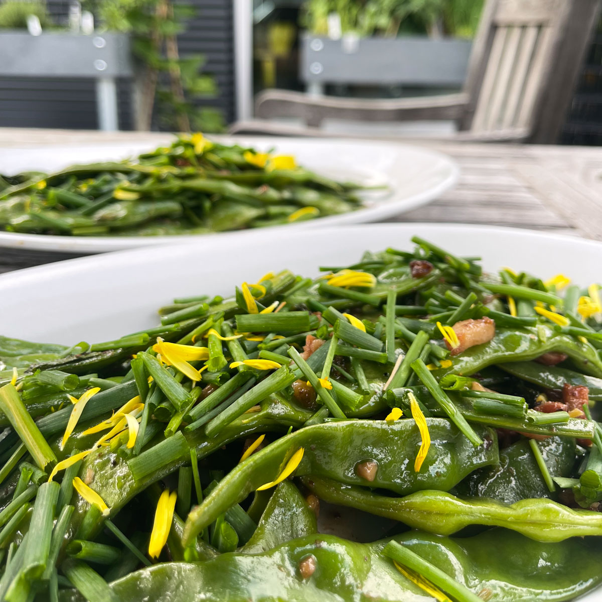 Stir-fry with Romano pole beans, chives and calendula petals