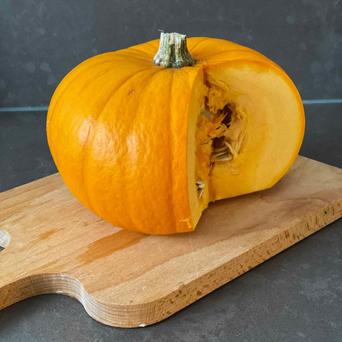 Cut orange pumpkin showing its firm flesh