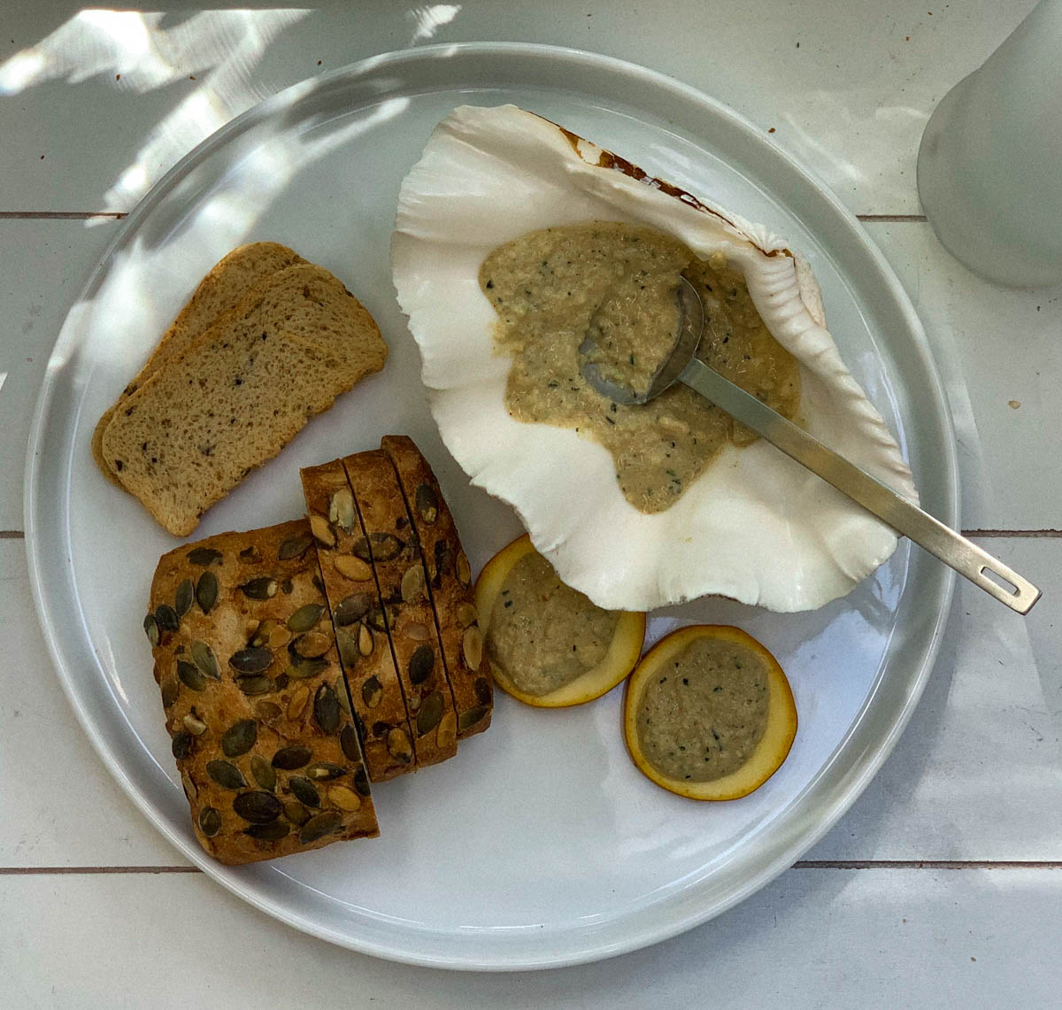 A bowl of smooth courgette hummus