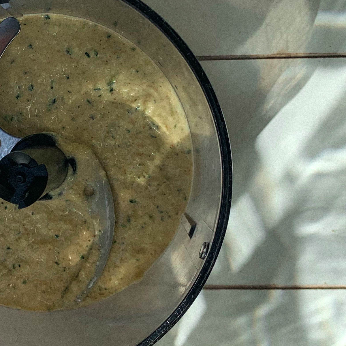 Courgette hummus being blended in a food processor