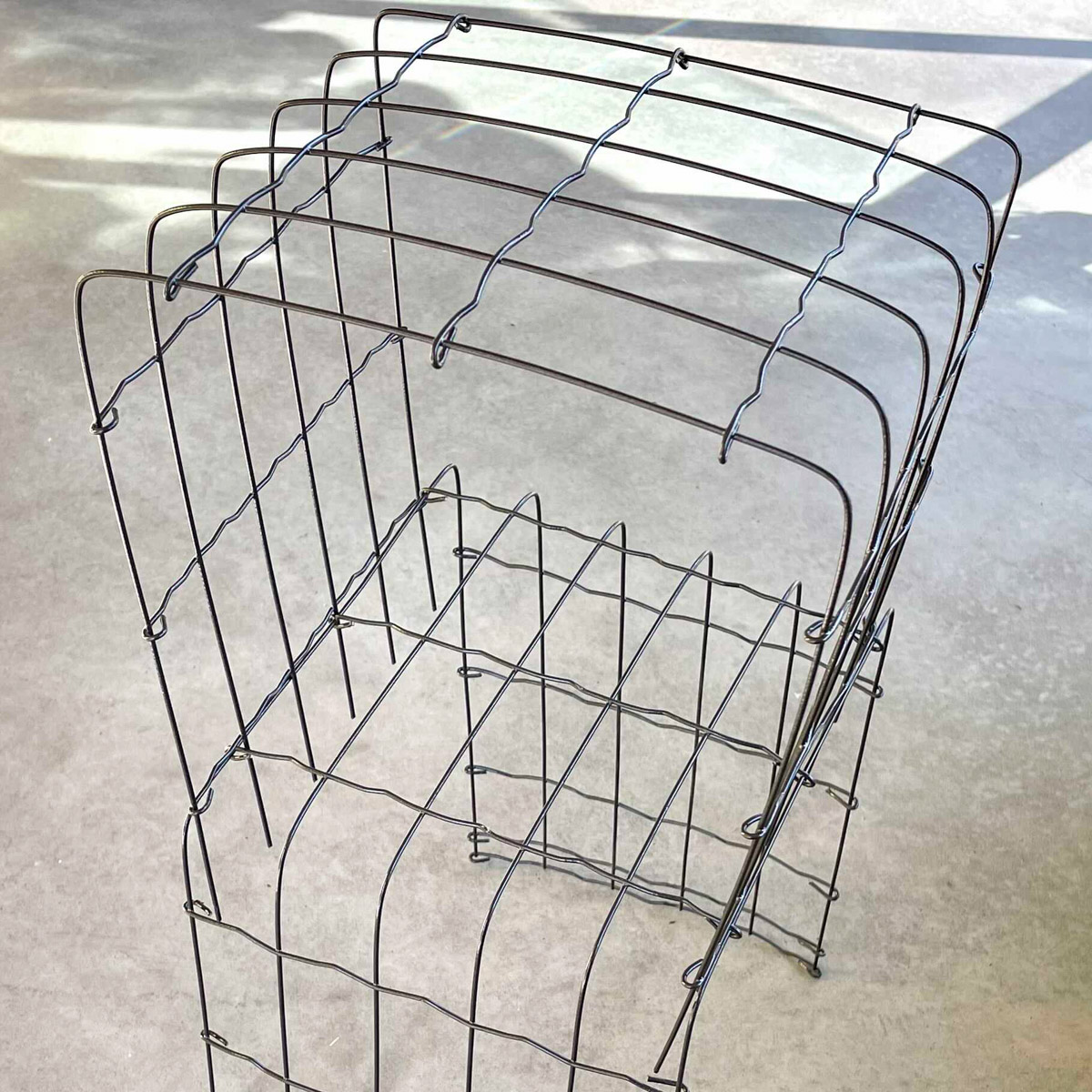 A support rack made from garden wire fencing with two layers to accommodate climbing plants